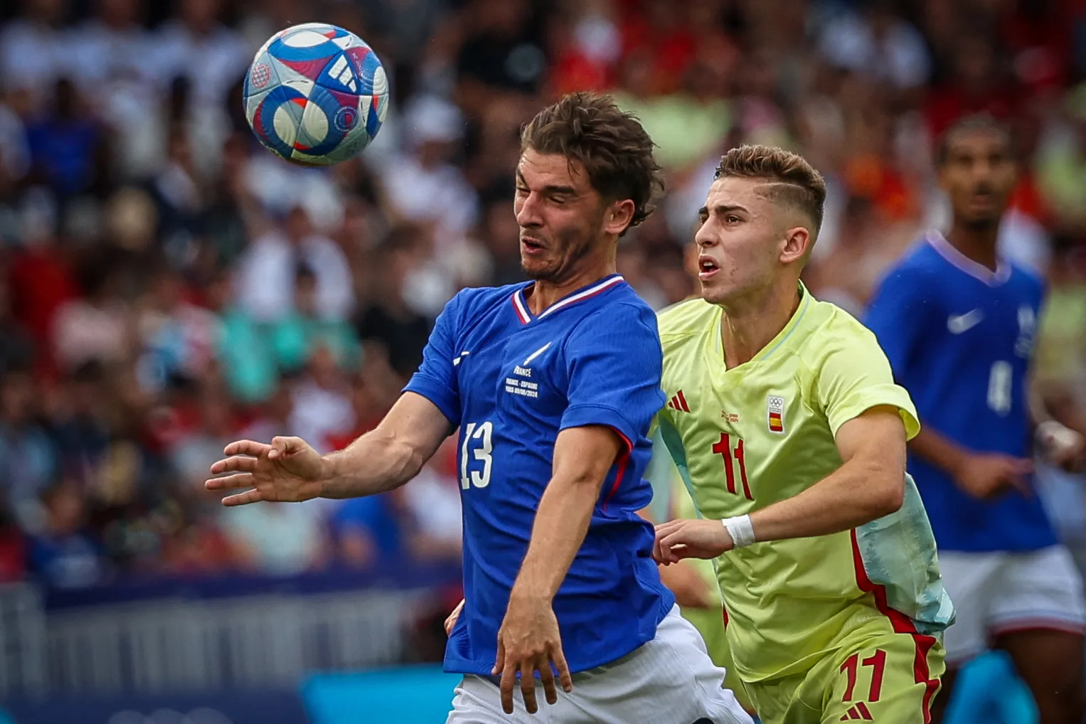 13 Joris CHOTARD of the France team is battling for possession with 11 Fermin LOPEZ of the Spain team during the Men's Gold Medal match between France and Spain during the Olympic Games Paris 2024 at Parc des Princes on August 09, 2024, in Paris, France. (Photo by Ayman Aref/NurPhoto) (Photo by Ayman Aref / NurPhoto / NurPhoto via AFP)