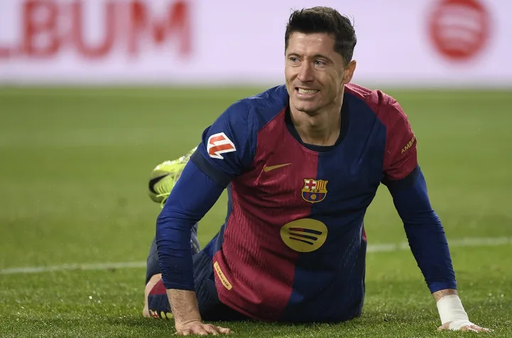 Barcelona's Polish forward #09 Robert Lewandowski falls on the ground during the Spanish league football match between FC Barcelona and Club Deportivo Leganes SAD at the Estadi Olimpic Lluis Companys in Barcelona on December 15, 2024. (Photo by Josep LAGO / AFP) FBL-ESP-LIGA-BARCELONA-LEGANES